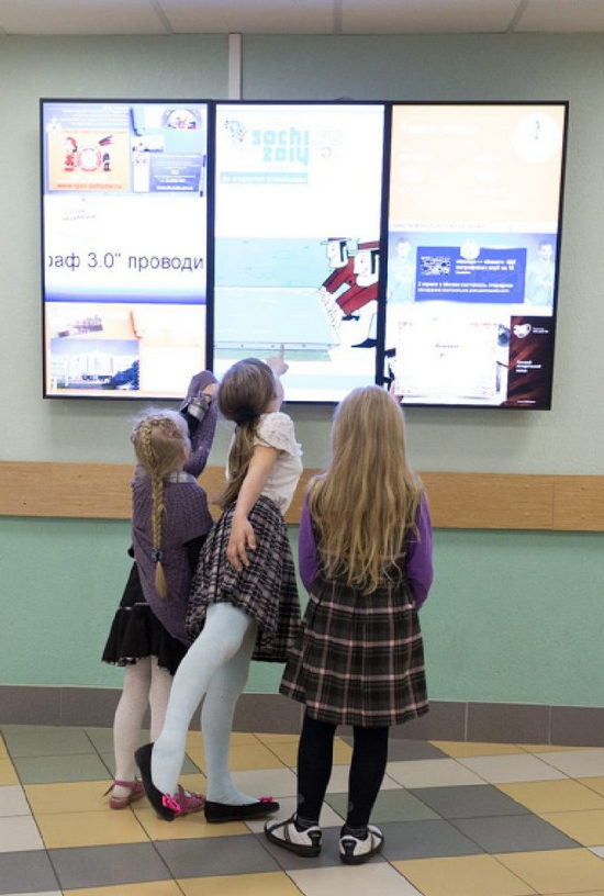 digital interactive touch screens in a school hall