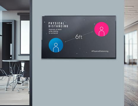 social distancing measures in the office shown on a digital display